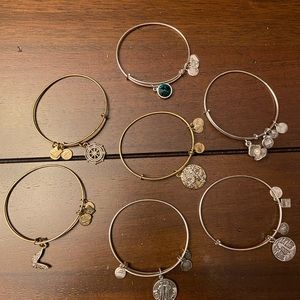 7 Alex and Ani bracelets.